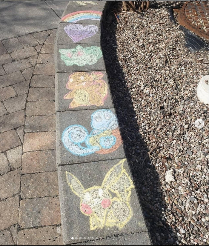 A simple chalk sketch of four pokemon on a raised concrete barrier. They are bulbsaur, squirtle, charmander and pikachu. These were done at the height of covid-19's lockdown while socially distanced playing with neighborhood children.